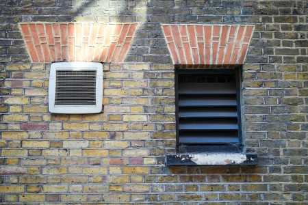 Exterior wall heater vent illustrating ideal time of year to install a heater in El Paso