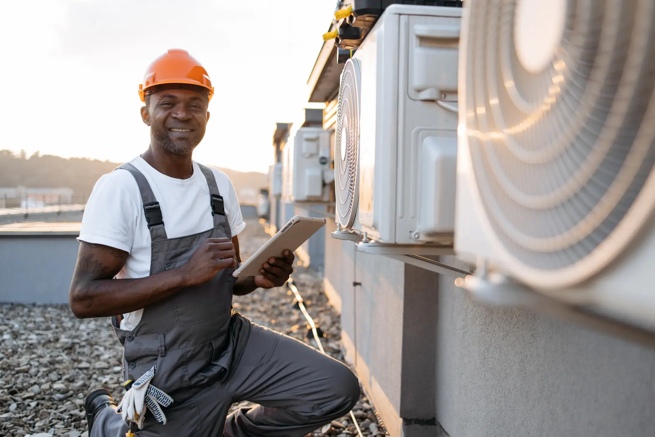 Certified HVAC technician inspecting outdoor heating unit
