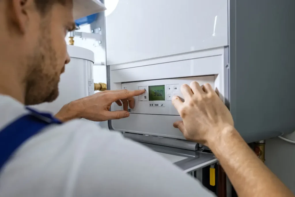 An HVAC technician performing heating repair in El Paso.